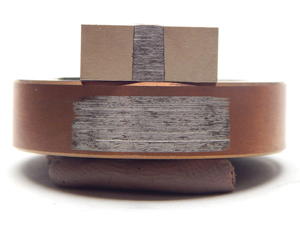 Fig. 3. Ring and block wear coating samples tested at elevated temperature. The coating held up well to this test. It has a relatively smooth, uniform wear band that shows minimal signs of galling.