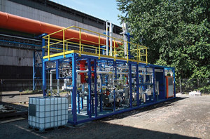 FIG. 3. Photo of the Carbon2Value CO/CO<sub>2</sub> separation pilot plant installed at the ArcelorMittal steel mill in Ghent, Belgium. The orange pipe contains the BFG that was fed to the unit.
