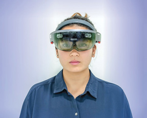 FIG. 1. Head-mounted displays use voice-recognition technology to offer users a wide range of both productivity tools and guidance, capturing pictures and video, pulling live data and connecting to experts in the central control room or elsewhere who can see what the user sees.