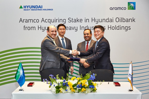Saudi Aramco and Hyundai Heavy Industries Holdings (HHIH) formalize the agreement for the Hyundai Oilbank share purchase in Seoul, South Korea. Saudi Aramco is represented by Ziad Murshed, Vice President of International Operations (left) while HHIH by Jong-chul Kim, Senior Vice President and Head of Corporate Management Office (right). The signing ceremony were witnessed by Saudi Aramco Senior Vice President of Downstream, Abdulaziz Al Judaimi (right, standing) and HHIH’s Ki-sun Chung, Senior Executive Vice President and Head of Group Corporate Planning (left, standing)